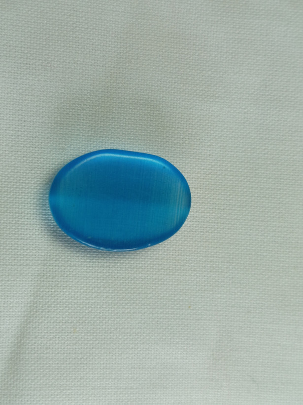 نگین چشم گربه ابی رنگ بیضی شکل